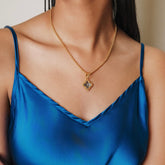 Quadra Pendant in Gold with Blue Topaz