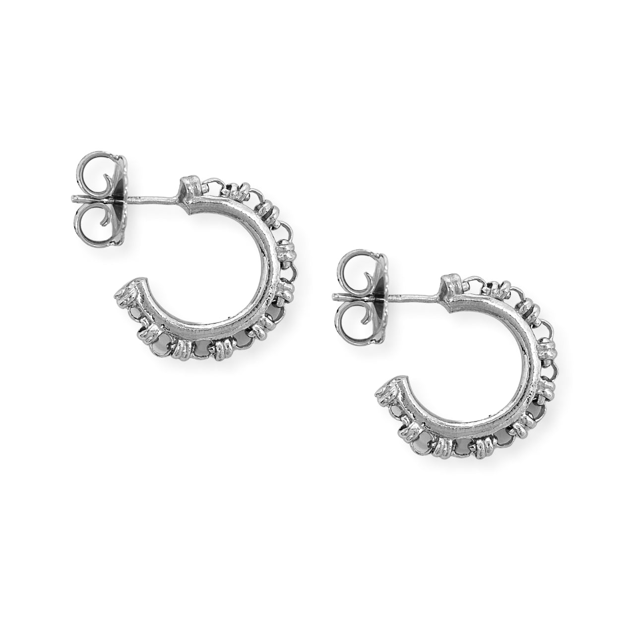 A closeup of silver hoop earrings designed and hand-crafted by DelBrenna Italian Jewelers in Tuscany. The earrings are based on the iconic Links collection of DelBrenna silver chains, necklaces, rings, and bracelets and feature a 3mm link chain design.
