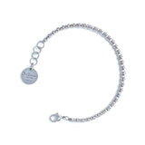 A silver chain bracelet with a round silver charm with the DelBrenna brand name against a white background. The silver bracelet has been handcrafted in Tuscany by DelBrenna Italian Jewelry artisans and designers. 