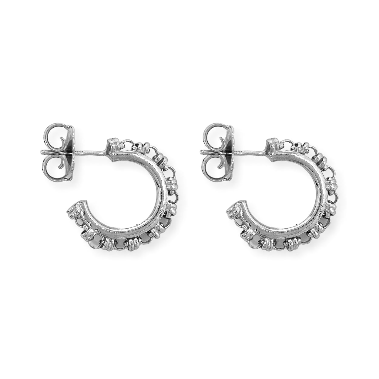 A closeup of silver hoop earrings designed and hand-crafted by DelBrenna Italian Jewelers in Tuscany. The earrings are designed based on the iconic Links collection of DelBrenna silver chains, necklaces, rings, and bracelets. 