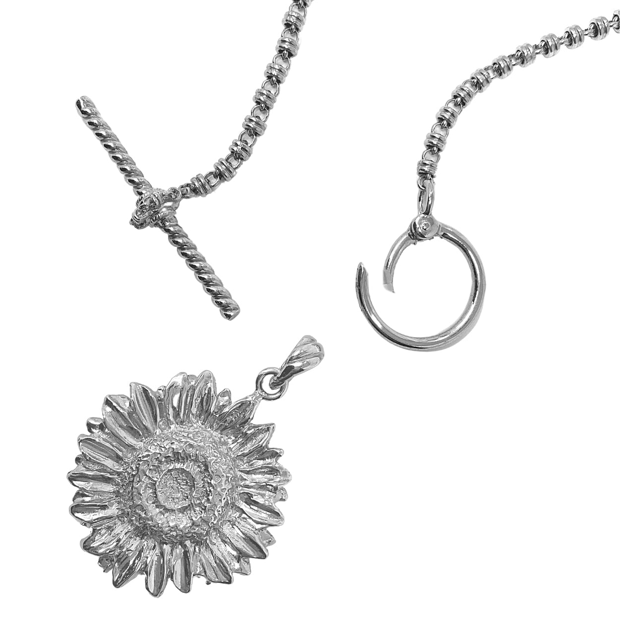 A closeup of the open silver toggle clasp with a silver sunflower pendant detached from a silver necklace - the silver chain is from the Links 3mm collection from DelBrenna Italian Jewelry designers and artisans. Hand-crafted in Tuscany.