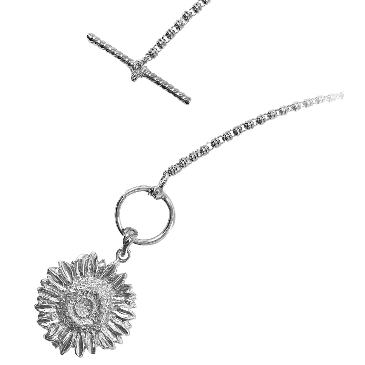 A closeup of the silver toggle clasp with an attached silver sunflower pendant detached from a silver necklace - the silver chain is from the Links 3mm collection from DelBrenna Italian Jewelry designers and artisans. Hand-crafted in Tuscany.